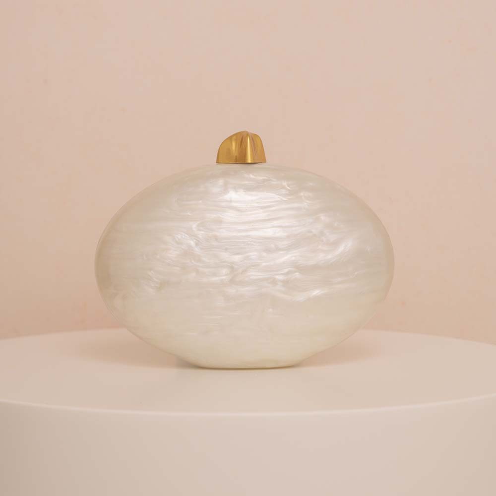 Bolso de mano con forma de hue - Interior Design News reseña y precio