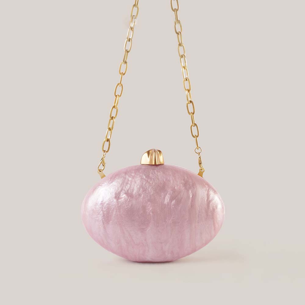 Bolso de mano con forma de hue - Interior Design News reseña y precio